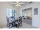 Inviting dining area with a ceiling fan and views into the living room at 2159 Leisure World --, Mesa, AZ 85206