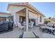 Relaxing covered outdoor patio featuring neutral furniture, privacy screen and tiled flooring at 2159 Leisure World --, Mesa, AZ 85206