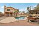 Spacious backyard with a pool, a covered swing, and a second-story balcony at 21960 N 70Th Dr, Glendale, AZ 85310