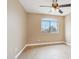 This carpeted bedroom has a ceiling fan and a window with views of the neighborhood at 21960 N 70Th Dr, Glendale, AZ 85310