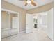 Neutral bedroom with mirrored closet doors and view to en-suite bathroom at 21960 N 70Th Dr, Glendale, AZ 85310