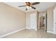 This bedroom features hard wood floors, ceiling fan and access to a connected bathroom at 21960 N 70Th Dr, Glendale, AZ 85310