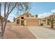 Attractive two-story home with a large driveway and desert landscaping at 21960 N 70Th Dr, Glendale, AZ 85310