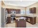 Kitchen features stainless steel appliances, granite countertops, and an island at 21960 N 70Th Dr, Glendale, AZ 85310