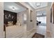 Spacious hallway featuring tile flooring, recessed lighting, and views into the play and living areas at 22854 E Sonoqui Blvd, Queen Creek, AZ 85142