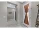 Hallway with decorative accents and neutral color palette leading to other rooms, providing a welcoming transition at 22854 E Sonoqui Blvd, Queen Creek, AZ 85142