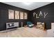 Playroom with black accent wall, decor and an organized play area for  at 22854 E Sonoqui Blvd, Queen Creek, AZ 85142