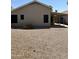 Backyard featuring a rock groundcover, with a covered patio and block fence at 2634 N Saffron Cir, Mesa, AZ 85215