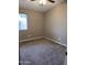 Neutral-toned bedroom featuring carpet and natural light from a window at 2634 N Saffron Cir, Mesa, AZ 85215