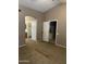 Neutral bedroom with carpeted floors showing entrances to the closet and bathroom at 2634 N Saffron Cir, Mesa, AZ 85215