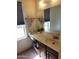 Bathroom featuring a sink, and a large mirror, with a window with neutral colored blinds at 2839 W Villa Maria Dr, Phoenix, AZ 85053