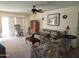 Comfortable living room with natural light, a ceiling fan, and access to the outdoor space at 2839 W Villa Maria Dr, Phoenix, AZ 85053