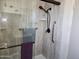 Shower with a glass door, a handheld shower head, and a grab bar at 2839 W Villa Maria Dr, Phoenix, AZ 85053