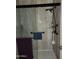 Shower with a glass door, handheld shower head, and neutral tile walls at 2839 W Villa Maria Dr, Phoenix, AZ 85053