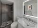 Bright bathroom showcases a modern vanity with a marble countertop and a tiled walk-in shower at 3009 W Laurel Ln, Phoenix, AZ 85029