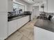 Modern kitchen with white cabinets, stainless steel appliances, and mosaic backsplash detail at 3009 W Laurel Ln, Phoenix, AZ 85029