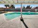 Large pool with a concrete deck, surrounded by a block wall and mature trees providing privacy at 3009 W Laurel Ln, Phoenix, AZ 85029