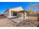 This backyard features a covered patio and desert landscaping at 35621 W San Alvarez Ave, Maricopa, AZ 85138