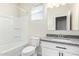 Well-lit bathroom with a tub,granite countertops, and ample cabinet space at 35621 W San Alvarez Ave, Maricopa, AZ 85138