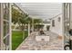 Inviting back patio with an open pergola, paver flooring, and a center flower bed at 4131 E Minnezona Ave, Phoenix, AZ 85018