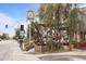 Outdoor dining at a restaurant, featuring shady trees and a classic clock sign, blends street views with ambiance at 4131 E Minnezona Ave, Phoenix, AZ 85018