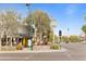 Inviting restaurant exterior with outdoor patio, shaded seating, and a vintage clock tower visible from the street at 4131 E Minnezona Ave, Phoenix, AZ 85018