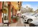 Charming outdoor seating area along the sidewalk with multiple tables and potted plants at a popular eatery at 4131 E Minnezona Ave, Phoenix, AZ 85018