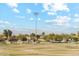 A view of the Community park including trees, a soccer field and surrounding houses at 4284 N 154Th Ave, Goodyear, AZ 85395