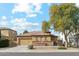 Charming single-story home featuring stone accents, a neutral color palette and a well-manicured front yard at 4284 N 154Th Ave, Goodyear, AZ 85395