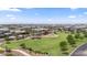 Community aerial view featuring green space, playground, and neatly arranged homes at 4330 S Neutron --, Mesa, AZ 85212