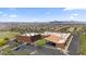 An aerial view displays a business building featuring plentiful parking and a convenient location, set against a backdrop of scenic mountains at 4330 S Neutron --, Mesa, AZ 85212