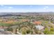 An aerial view captures baseball fields, a community pool, and recreational areas nestled among homes at 4330 S Neutron --, Mesa, AZ 85212