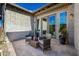 Cozy back patio with comfortable seating, complemented by stone pavers and modern design elements at 4330 S Neutron --, Mesa, AZ 85212