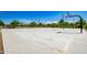 Outdoor community basketball court with well-maintained concrete, hoops, and landscaping under a clear blue sky at 4330 S Neutron --, Mesa, AZ 85212