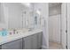 Bright bathroom with dual sinks, modern fixtures, and a separate shower stall at 4330 S Neutron --, Mesa, AZ 85212