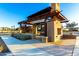 Inviting outdoor gathering space with a rustic pergola, seating, and landscaped surroundings at 4330 S Neutron --, Mesa, AZ 85212