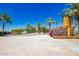 Community entrance with 'Home Finding Center' signage, palm trees, and a welcoming entry at 4330 S Neutron --, Mesa, AZ 85212