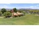 A large grassy park provides a central gathering spot with covered picnic areas, perfect for events and relaxation at 4330 S Neutron --, Mesa, AZ 85212