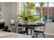 Dining area featuring a round table with metal chairs and a large window with a view to the exterior at 4330 S Neutron --, Mesa, AZ 85212