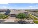 Charming single-story home featuring a well-manicured front yard, desert landscaping, and a two-car garage at 4330 S Neutron --, Mesa, AZ 85212