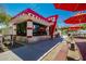 Whimsical diner with red umbrellas, outdoor seating, and ample sunlight, perfect for a unique dining experience at 4330 S Neutron --, Mesa, AZ 85212