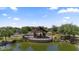 A lakeside gazebo with seating offers a tranquil retreat surrounded by lush greenery and serene water views at 4330 S Neutron --, Mesa, AZ 85212
