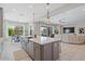 Open-concept kitchen with stainless steel appliances and seamless flow to the living area at 4330 S Neutron --, Mesa, AZ 85212