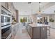 Bright, open kitchen with stainless steel appliances, an island, and plenty of natural light at 4330 S Neutron --, Mesa, AZ 85212