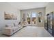 Cozy living room with neutral furniture, natural light, and a view to the patio at 4330 S Neutron --, Mesa, AZ 85212