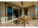 This inviting outdoor patio features a dining table and sliding glass doors, seamlessly blending indoor and outdoor living spaces at 4330 S Neutron --, Mesa, AZ 85212