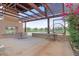 Charming outdoor seating area with a pergola, fireplace, and views of the community playground at 4330 S Neutron --, Mesa, AZ 85212