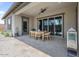 Covered patio with dining table and outdoor seating, perfect for entertaining and relaxing at 4330 S Neutron --, Mesa, AZ 85212