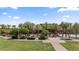 A community picnic area, shaded by mature trees, with tables inviting residents to gather and enjoy outdoor meals at 4330 S Neutron --, Mesa, AZ 85212