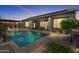 An inviting backyard pool with a pergola, lounge chairs, and a neatly paved patio at 4330 S Neutron --, Mesa, AZ 85212